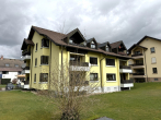 Außenansicht Rückseite - Bezugsfreie 4,5-Zimmer-Wohnung mit Loggia und Tiefgaragenstellplatz in ruhiger Lage