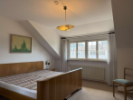 Schlafzimmer im Obergeschoss - Charmantes Einfamilienhaus mit moderner Einliegerwohnung in beliebter Lage von Lörrach-Tumringen